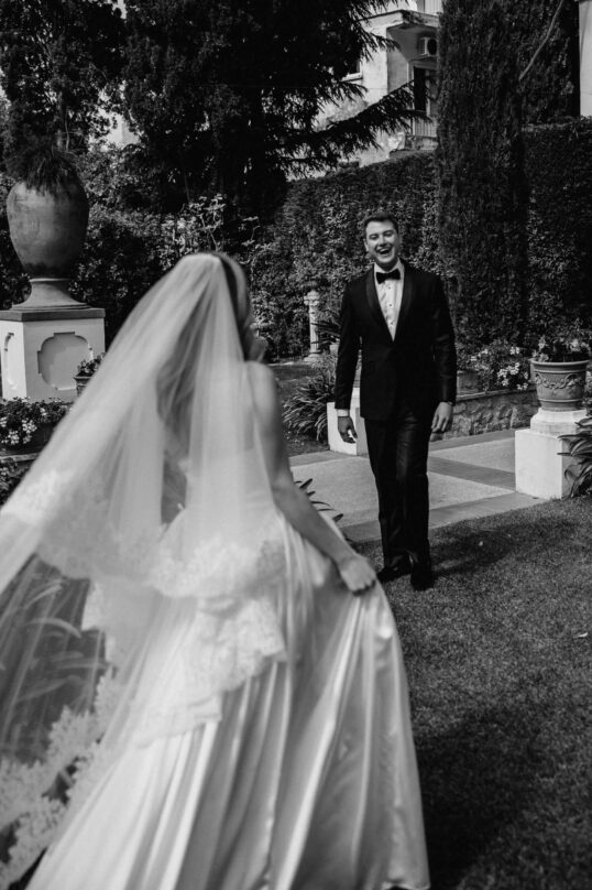159_JIN_6672 Bride walking through the gardens of Villa Eva with her father