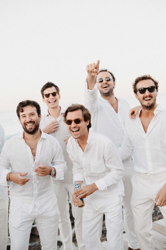271_JIN_4619 Groom and friends celebrating together at the white party