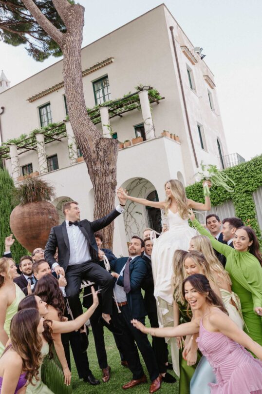 370_JIN_8141 Bride and groom celebrating with their wedding party at Villa Eva