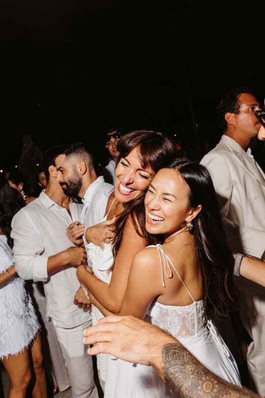 430_JIN_5952 Guests dancing together during the white party at Cala Maka