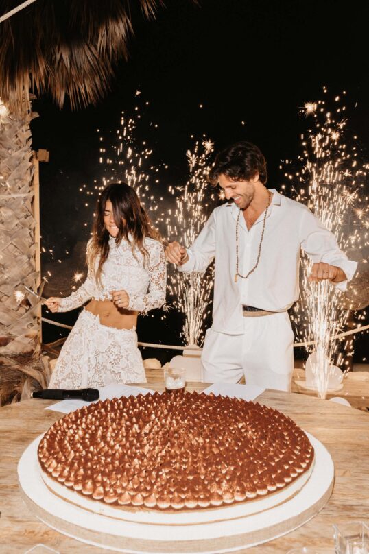 652_JIN_7442 Bride and groom cutting their wedding cake at Cala Maka